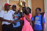 KUSA President awarding UON Tennis captain the No.1 Trophy