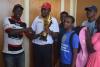 Director  of Sports presenting the trophy to tennis men captain