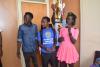 Director  of Sports presenting the trophy to tennis men captain