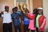 Director  of Sports presenting the trophy to tennis men captain