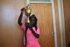Tennis captain displaying the trophy she won on singles