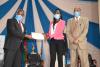 UoN Sports Volleyball  captain receives an Award from the UoN Vice Chancellor 