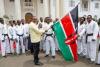President Uhuru Kenyatta flags off kenyan flag with Tae kwon do Team